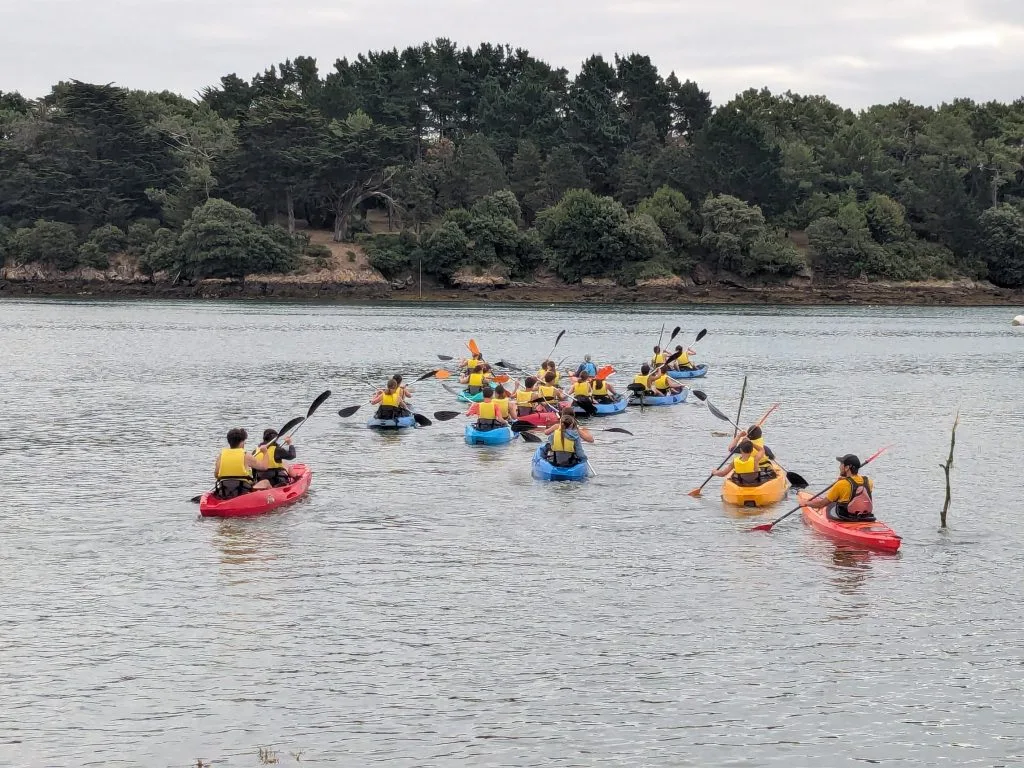 Group of children kayaking in the Gulf of Morbihan.